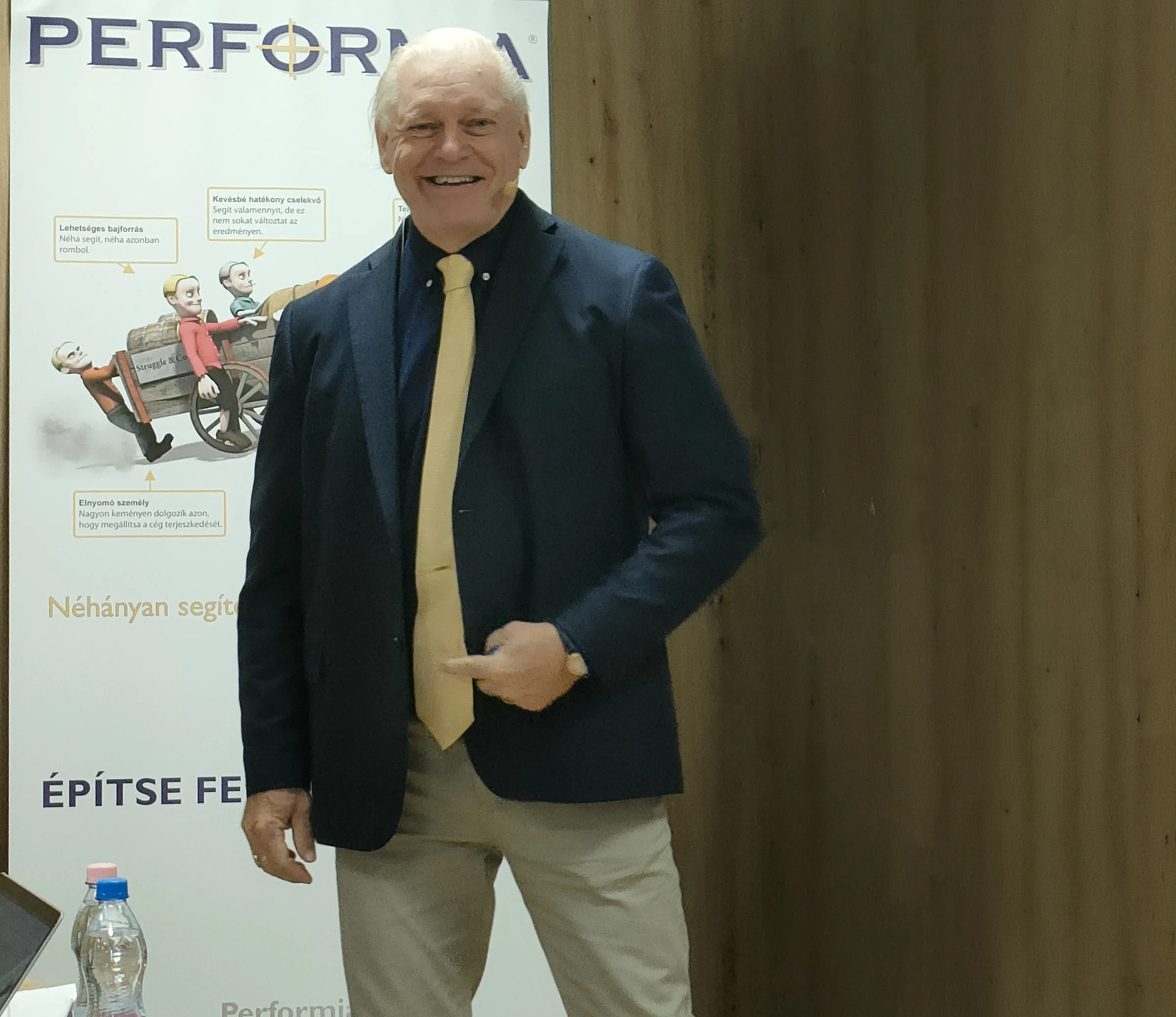 Mårten Runow smiling in front of a Performia banner
